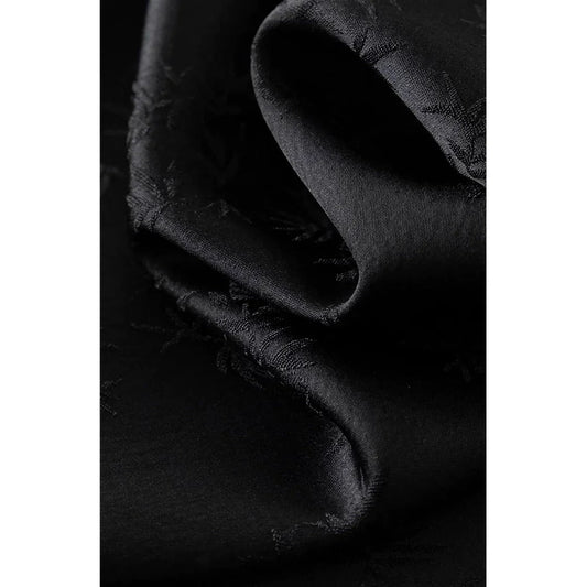 Elegant mint green midi dress with spaghetti straps, featuring a slim fit and intricate embroidery details