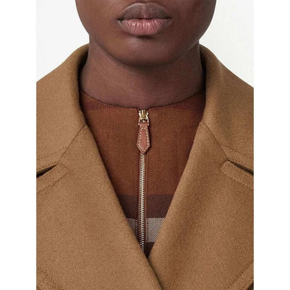 A stylish, mid-length double-breasted overcoat in a rich brown color, designed with a turn-down collar and practical patch pockets for a polished, versatile look.