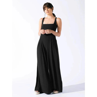 Chic sleeveless jumpsuit with wide-leg pants, made with Rayon and Spandex for comfort and breathability.
