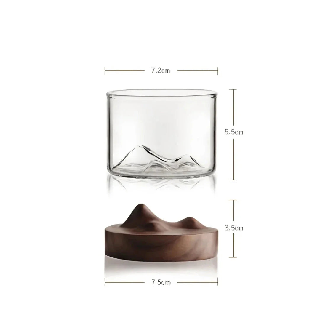 Elegant mountain-inspired whiskey glass with a wooden base, perfect for enjoying a variety of hot and cold beverages