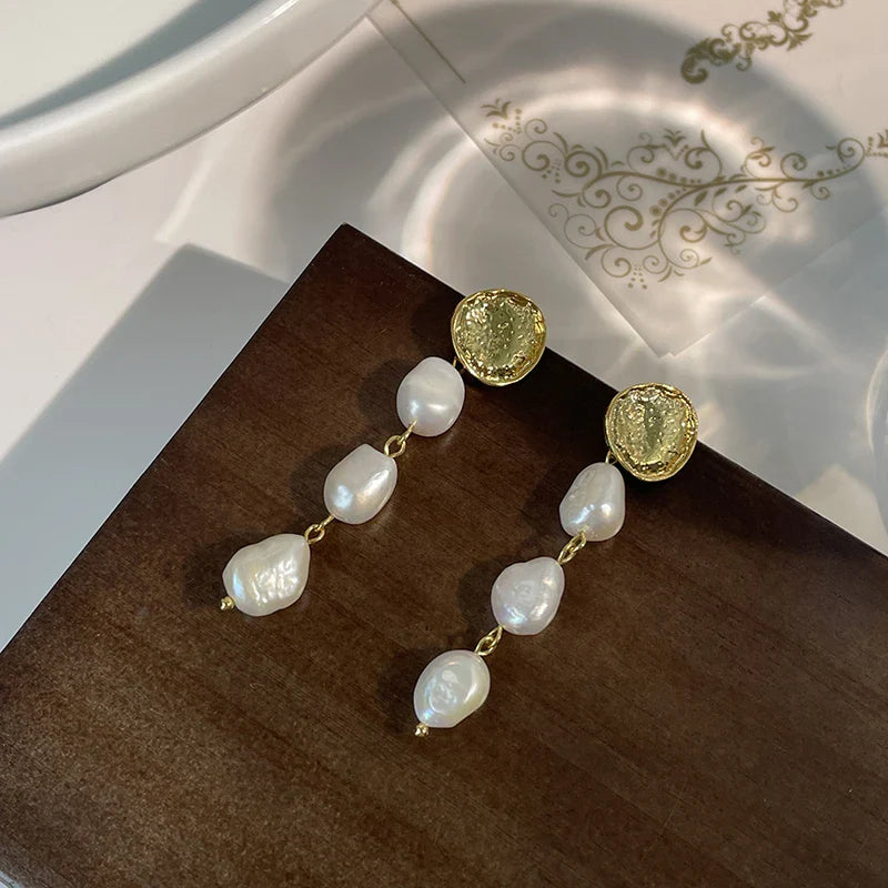 Elegant gold coin long earrings with a luxurious, statement-making design