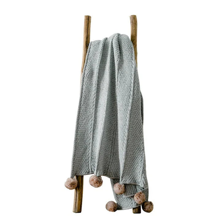 Cozy chenille ball-knit wool blanket in pink, gray, and white colors