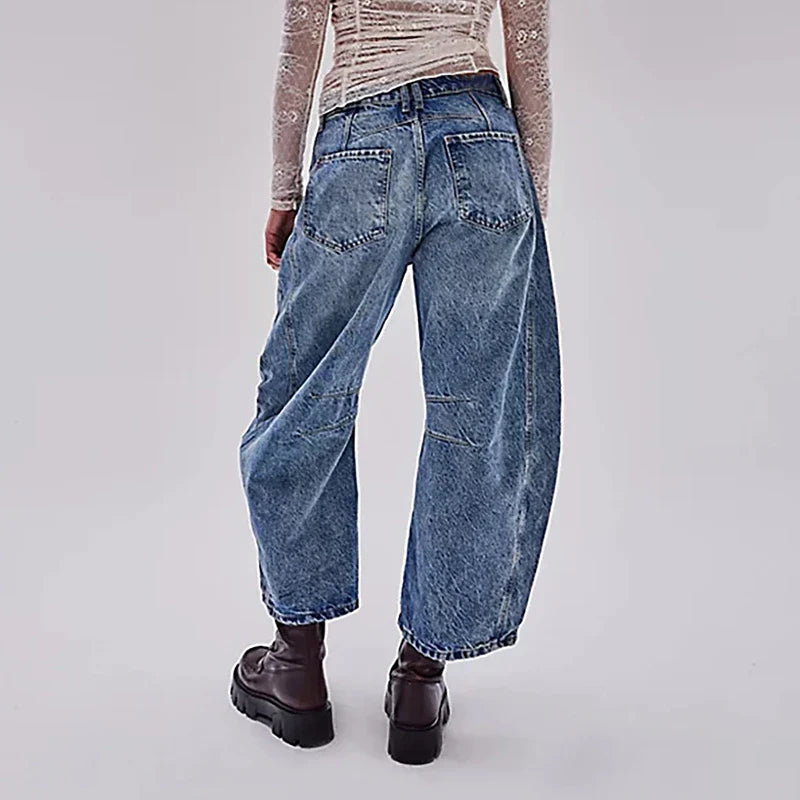 Trendha wide-leg summer pants in light blue, white, and black colors with a relaxed, stylish design