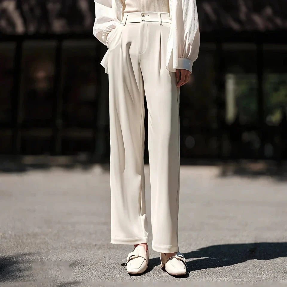 Effortless wide-leg summer trousers for women in white, featuring a relaxed fit, breathable cotton fabric, and functional pockets