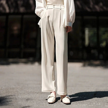 Effortless wide-leg summer trousers for women in white, featuring a relaxed fit, breathable cotton fabric, and functional pockets