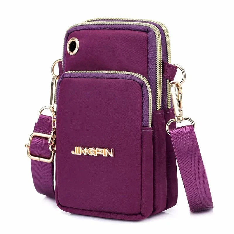 Fashionable women's crossbody phone bag with multi-function pockets, headphone plug, and stylish decorations