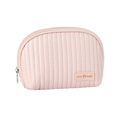 Stylish compact makeup bag made of premium PU leather in light blue color, with a sleek minimalist design for modern women