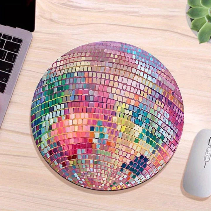 Dazzling pink disco ball-patterned mouse pad with a smooth, rubber surface and non-slip base for a stylish and functional desk accessory.
