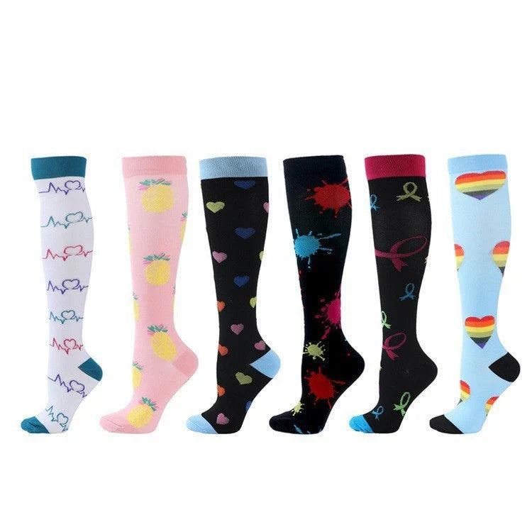 Pairs of long tube compression sports socks in a variety of stylish color combinations