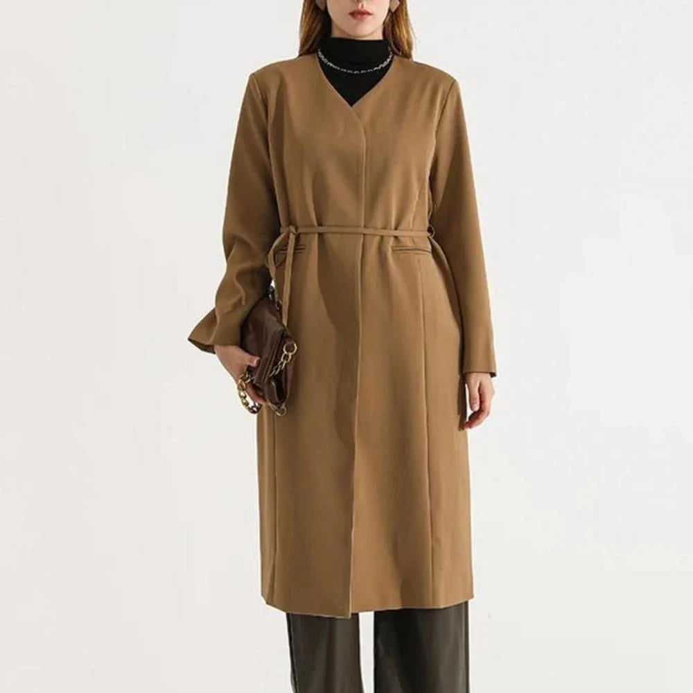Women's full-length trench coat with lace-up waist, turn-down collar, and elegant full sleeves