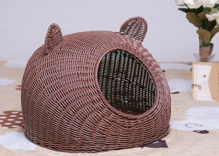 A cozy round woven pet bed made of premium wicker with a soft, plush interior for maximum comfort and style.