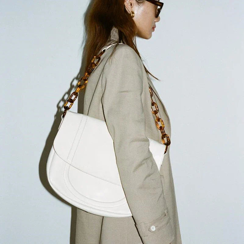 Stylish personalized acrylic chain shoulder bag in a creamywhite color, featuring a versatile tote design with a large capacity interior.