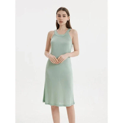 Elegant silk-blend halter neck midi dress in green and white colors, showcasing a chic and versatile design for modern American women.