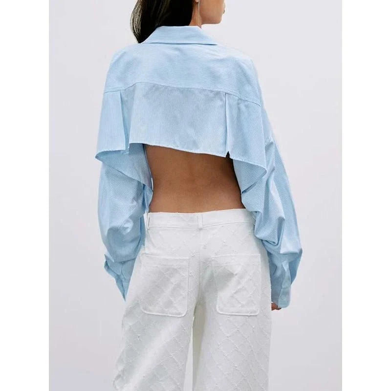 Chic patchwork blouse with functional pockets, perfect for casual and semi-formal occasions
