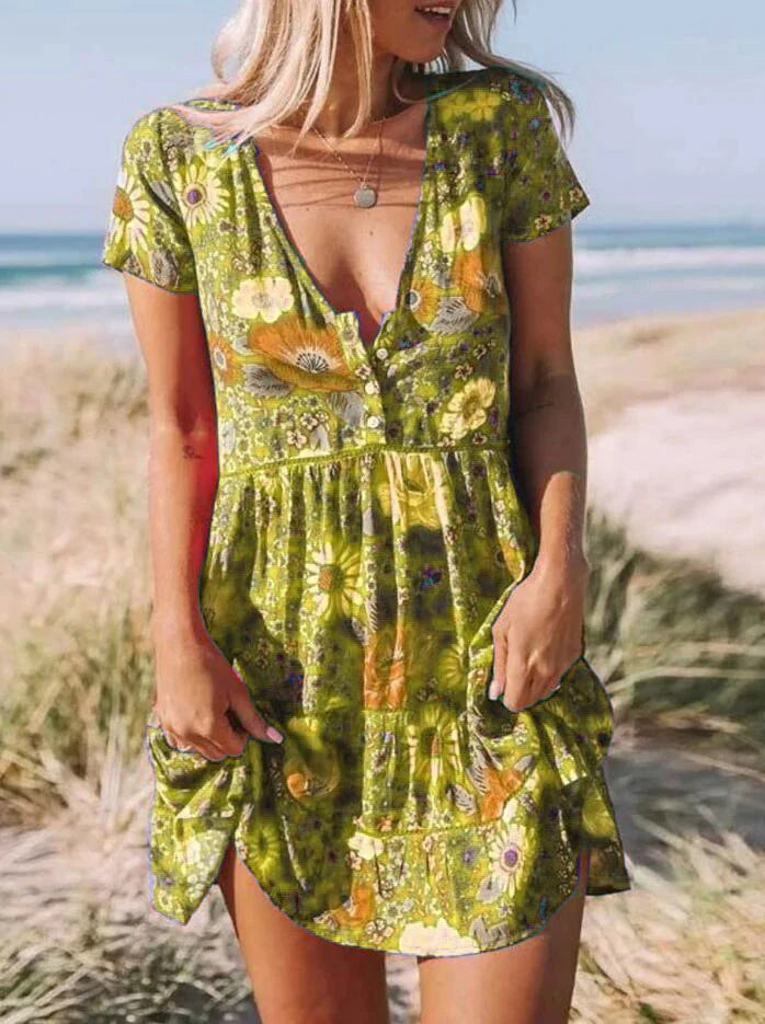 A stylish women's dress with a vibrant printed pattern, V-neck, and short sleeves.