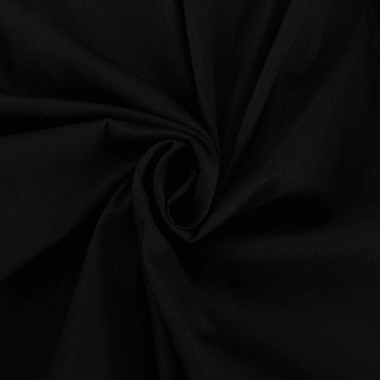 Black and white color-blocked dress with long sleeves and a doll collar, showcasing a timeless and sophisticated style.
