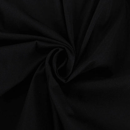 Black and white color-blocked dress with long sleeves and a doll collar, showcasing a timeless and sophisticated style.
