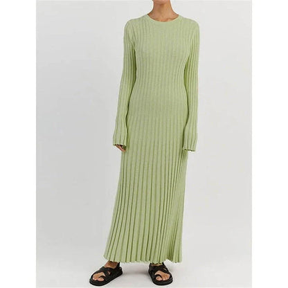 Timeless elegant pleated knit dress in black, perfect for summer office wear with a sophisticated and comfortable design.