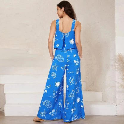 A stylish wide-leg jumpsuit with a paisley print design and a suspender top, perfect for women's casual and streetwear fashion.