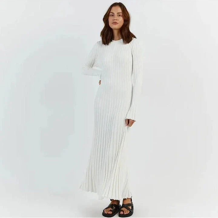 Timeless elegant pleated knit dress in black, perfect for summer office wear with a sophisticated and comfortable design.