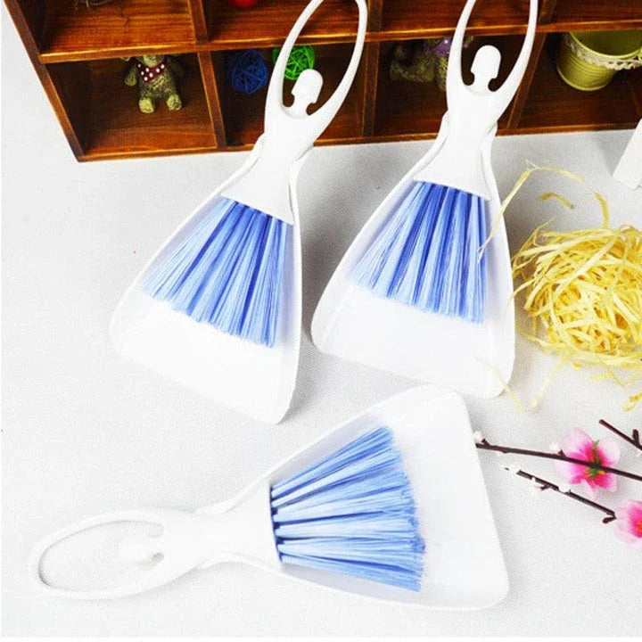 A versatile cage cleaning set with a brush and shovel for efficiently sweeping and scooping small pet bedding and waste