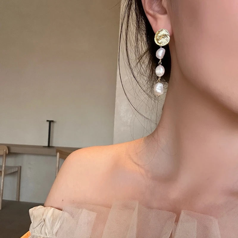 Elegant gold coin long earrings with a luxurious, statement-making design