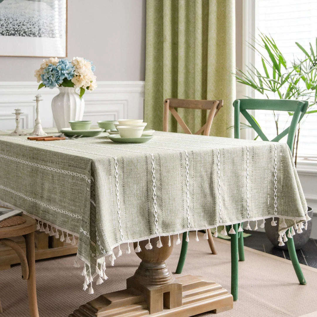 Elegant hollowed-out green tablecloth with a sophisticated and rustic design, perfect for American-style dining and events
