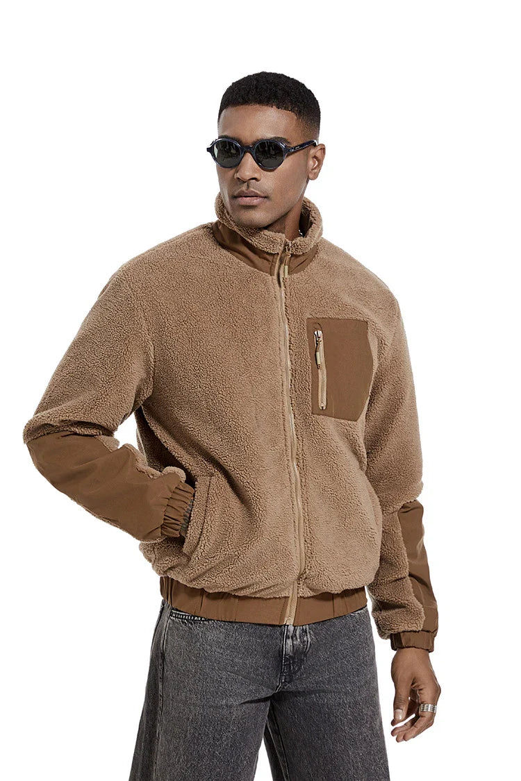 A cozy and stylish men's fleece jacket with a standing collar and convenient side pockets, available in a range of classic colors.