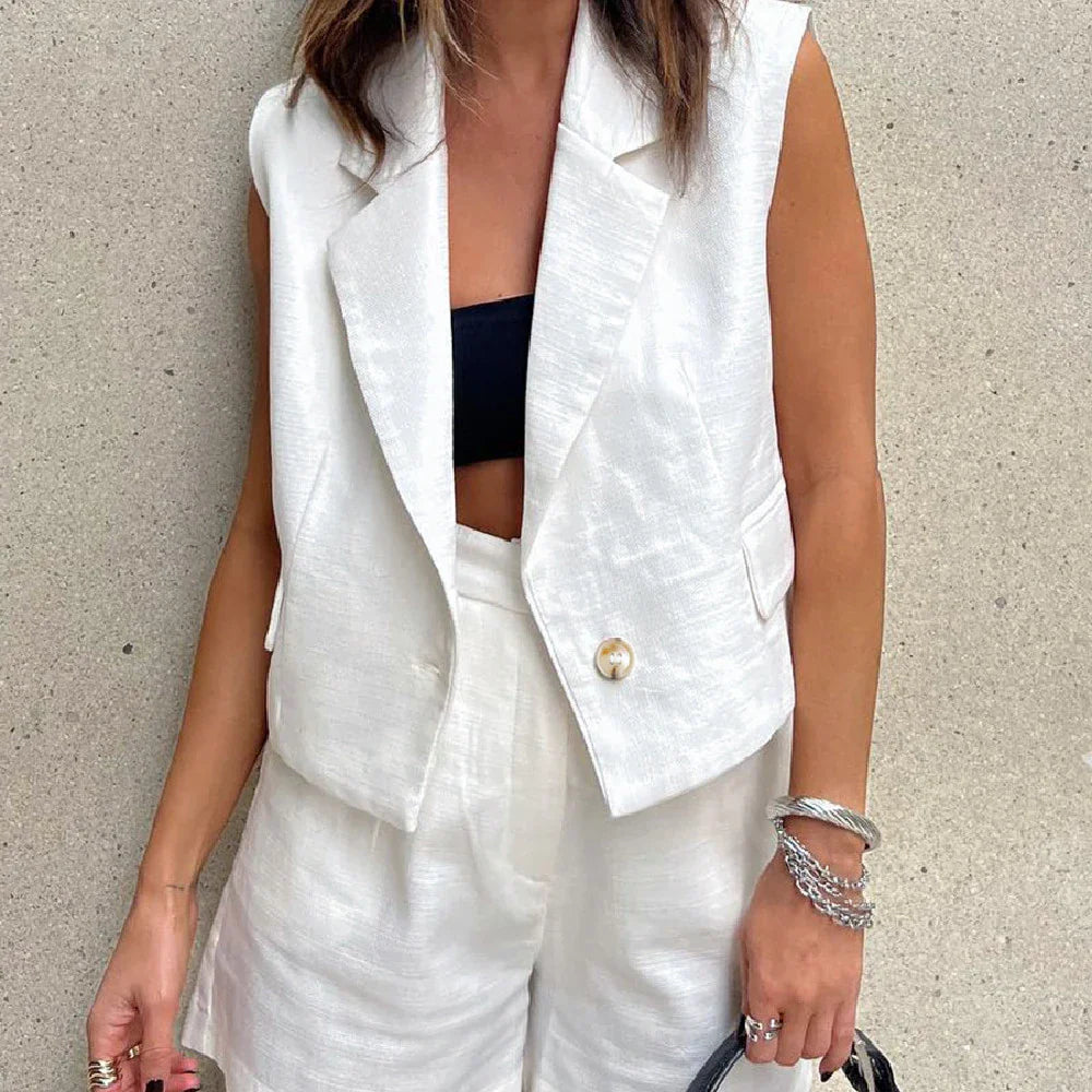 Fashionable white tailored collar vest and matching shorts set with stitched details for a refined, versatile look