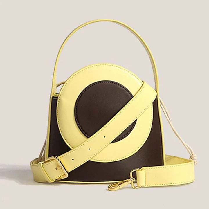 Chic color block vegan leather bucket bag with adjustable strap, perfect for everyday use and special occasions