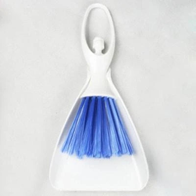 A versatile cage cleaning set with a brush and shovel for efficiently sweeping and scooping small pet bedding and waste