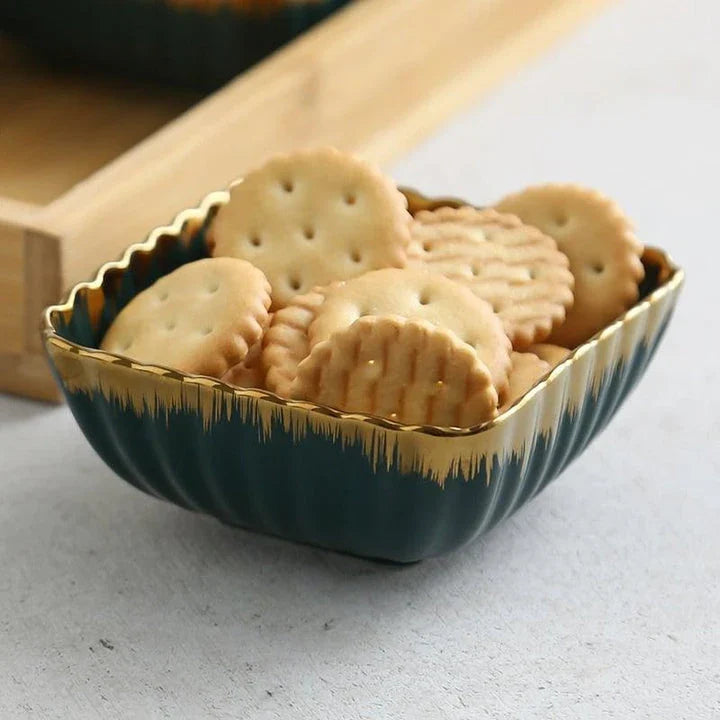 Elegant green and gold ceramic serving platter with a wood trim, perfect for hosting and elevating your dining experience.