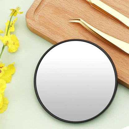 A high-definition magnifying mirror with a strong suction cup attachment for hands-free use in the bathroom or on the go.