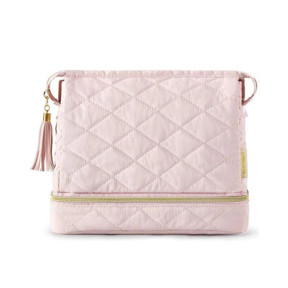 Elegant dual-layer makeup organizer bag in pink color with stylish tassel zippers and smooth zipper closure for easy access to cosmetics and beauty essentials