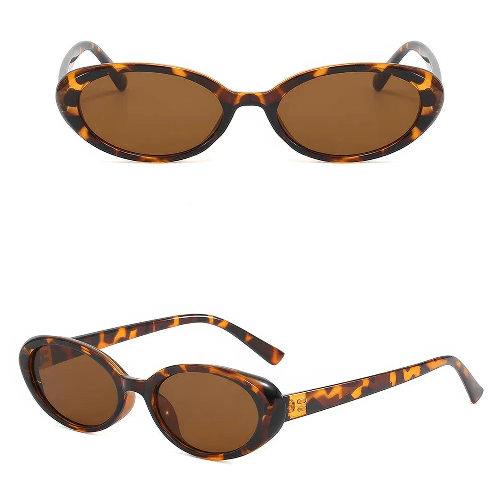 Chic oval sunglasses with white grey acetate frames and polycarbonate lenses, designed for fashionable women to shield their eyes from UV rays in style.