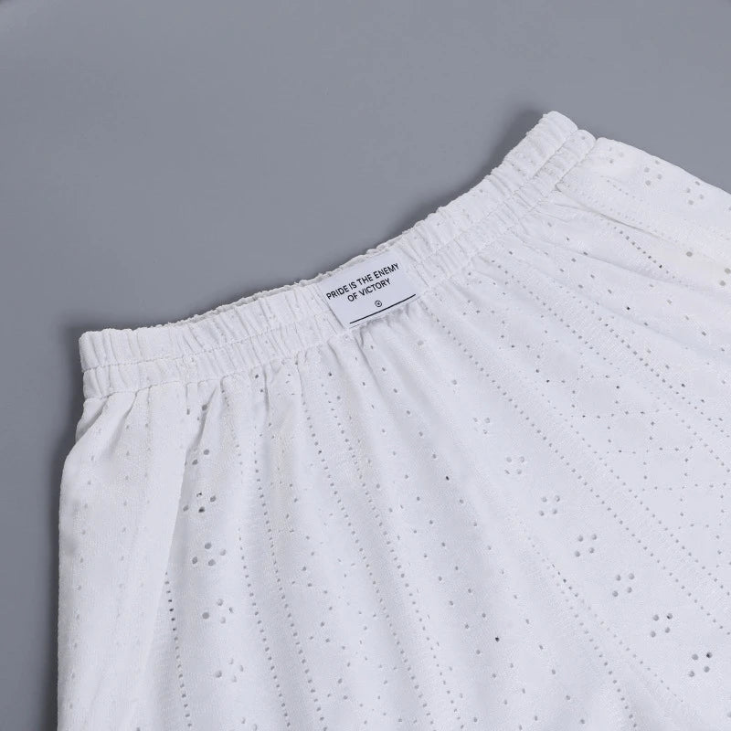 Trendha Women's Long Sleeve Pullover Top and Shorts Set in White, featuring a chic hollow-out design and flattering slim fit