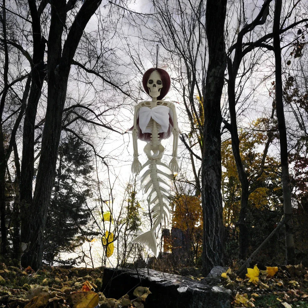 Mermaid bone pendant in various colors, including brown, dark purple, burgundy, and lake blue, hanging outdoors for Halloween decoration