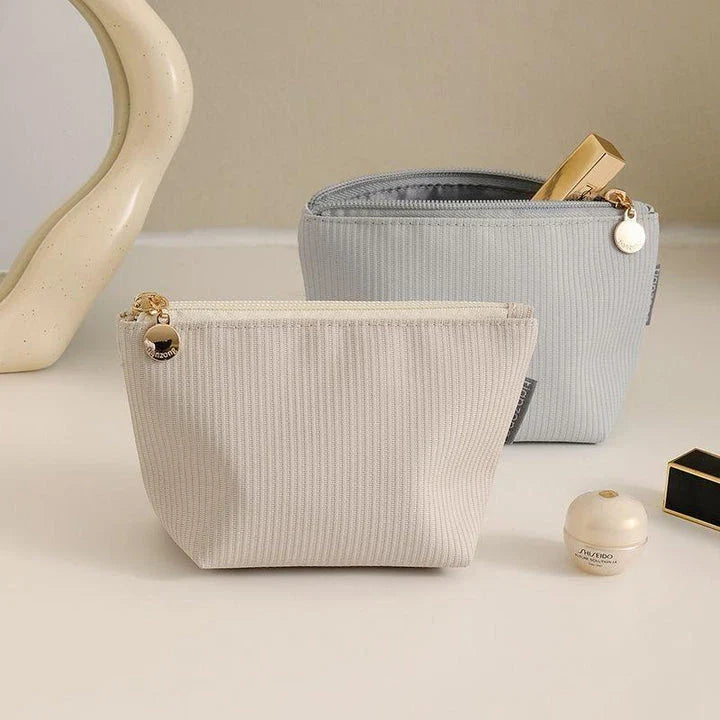 Mini portable waterproof cosmetic bag in beige and gray colors with a foldable design for convenient storage