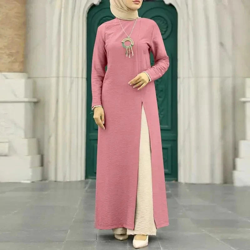 Elegant polyester dress with long sleeves, high slit hem, and available in caramel, black, blue, green, and pink colors