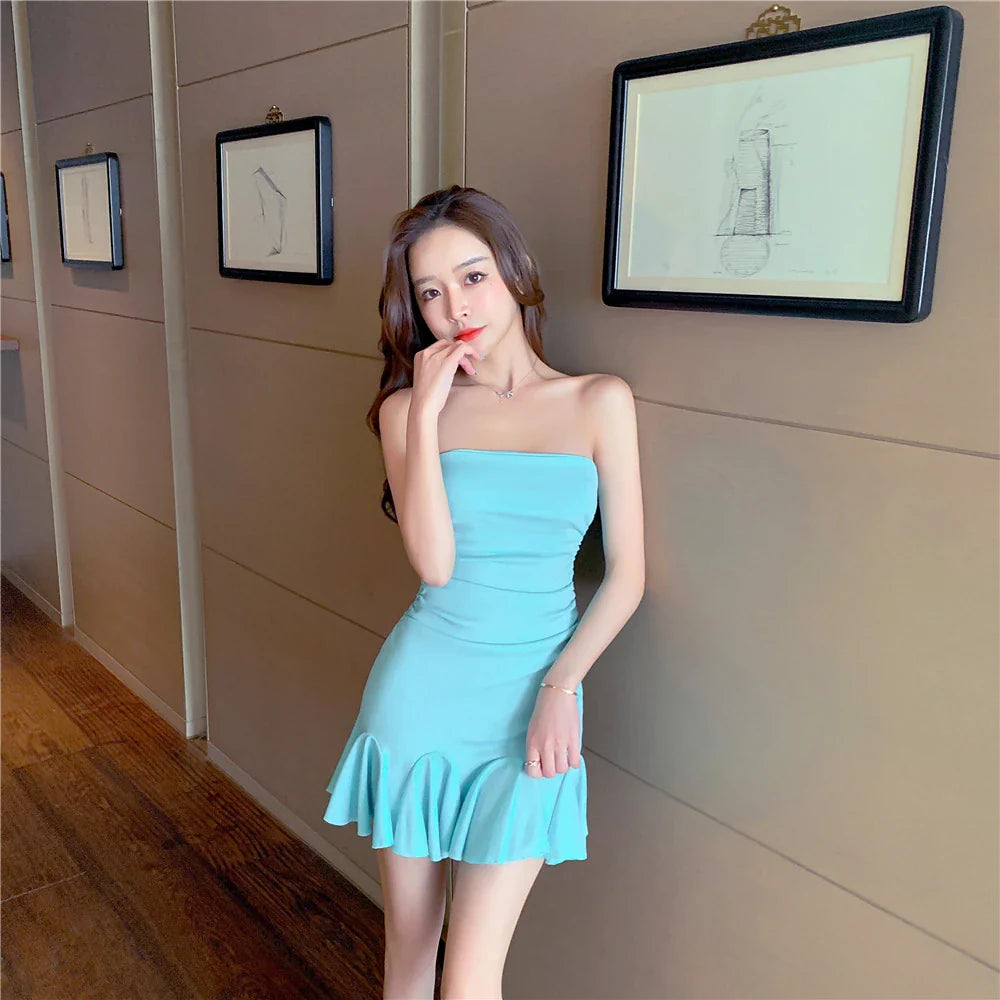 Off-the-shoulder tube top dress with ruffled hip wrap, available in black and lake blue colors