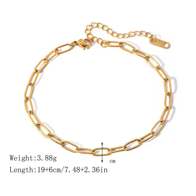 A close-up view of a 18K gold-plated stainless steel paper clip chain anklet, showcasing its elegant and minimalist design.