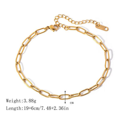 A close-up view of a 18K gold-plated stainless steel paper clip chain anklet, showcasing its elegant and minimalist design.