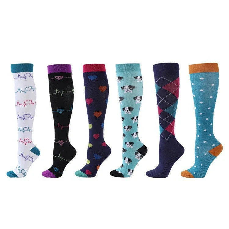 Pairs of long tube compression sports socks in a variety of stylish color combinations