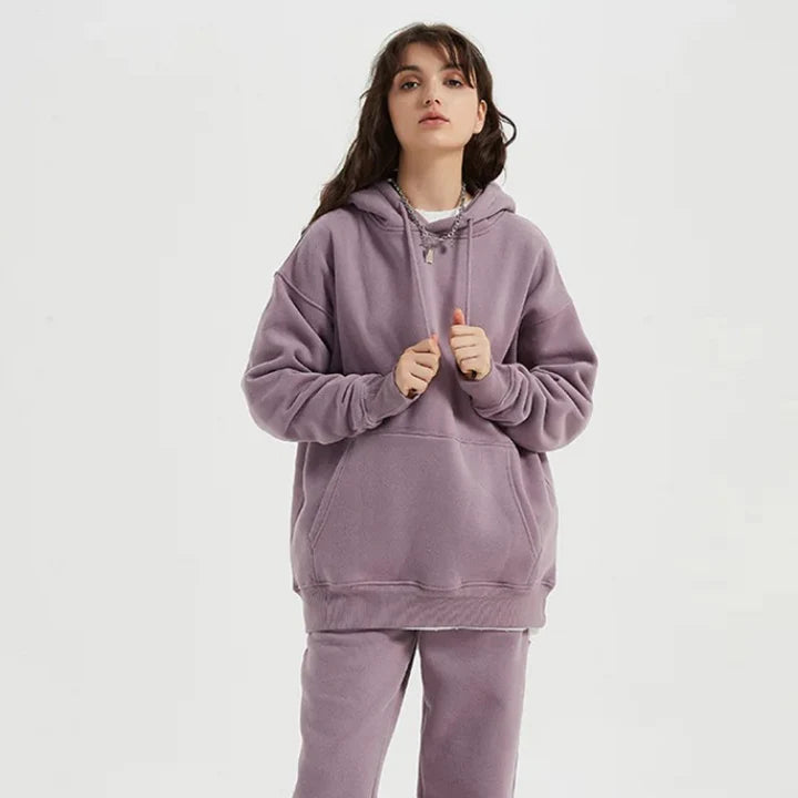 Cozy Fleece Hoodie and Sweatpants Set in Light Pink, featuring a relaxed fit and hooded design for maximum comfort and style.