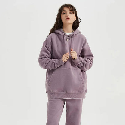 Cozy Fleece Hoodie and Sweatpants Set in Light Pink, featuring a relaxed fit and hooded design for maximum comfort and style.