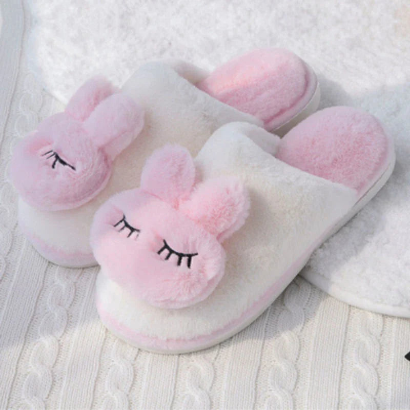 Cozy cotton slippers in a soft pink color, featuring a plush, non-slip design for comfortable home wear