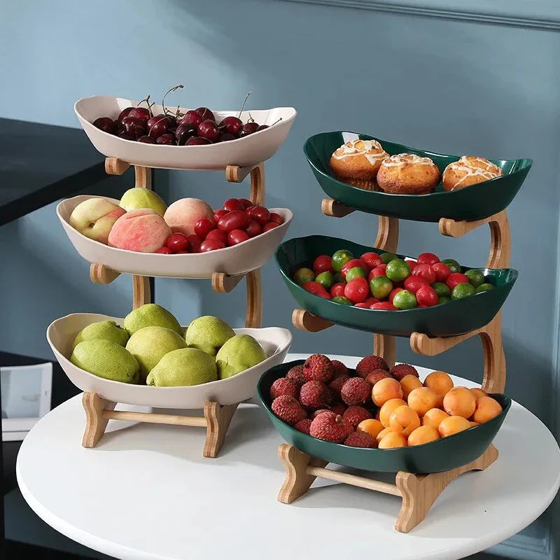 Three-tier plastic and bamboo fruit display tray with unique leaf-shaped design, available in white, beige, and green colors