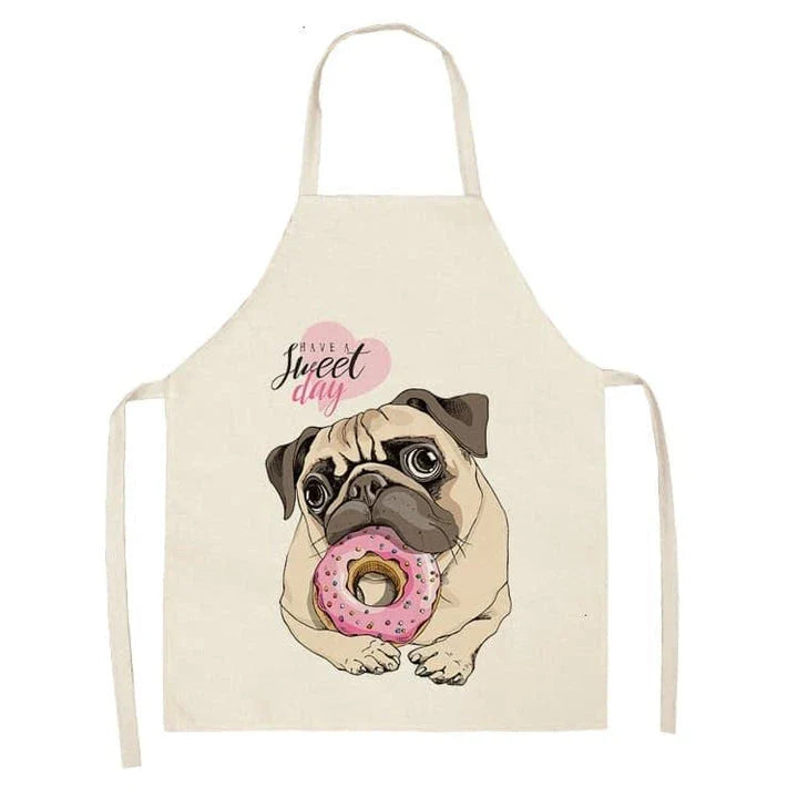 Charming pug-themed apron with a vibrant print, made of durable cotton and linen materials for practical kitchen use.