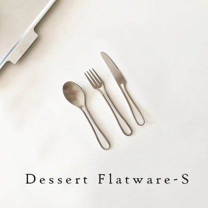 Sleek and modern 304 stainless steel cutlery set with a black finish, including knife, fork, and spoon for dinner and dessert.