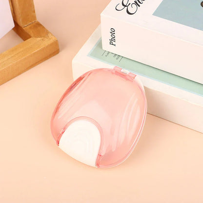 Compact, transparent dental retainer storage box with a push-to-open mechanism for easy access to dental appliances